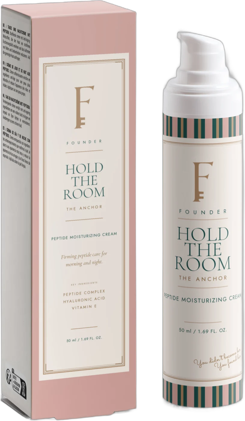 Hold the Room: the airless bottle and its carton, Desert Pink with a cream cartouche and gold crest.